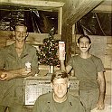 Christmas cheer 1970: Section Chief Bill Watson (left), Lt. Tom Hynes (seated) and Joe Tomlinson (right).